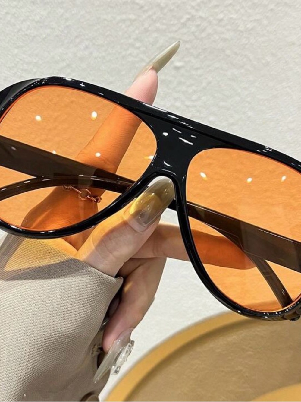 Black Sunglasses with Orange Lenses